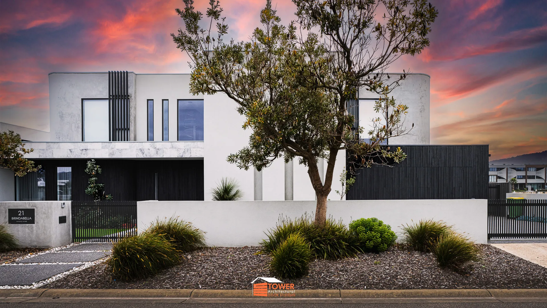 Architectural Range — Natural Series Location: Melbourne Builder: Amazing Homes Style Profile: A bold and sculptural façade, this project features a Flushmount Pro door clad in charred Shou Sugi Ban—style timber.