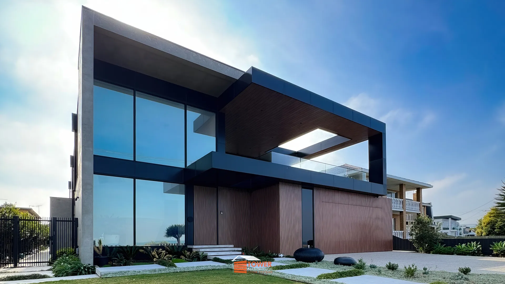 Architectural Range — Batten Series Location: Melbourne Style Profile: A striking coastal-modern façade defined by clean geometry, expansive glazing, and warm timber tones.