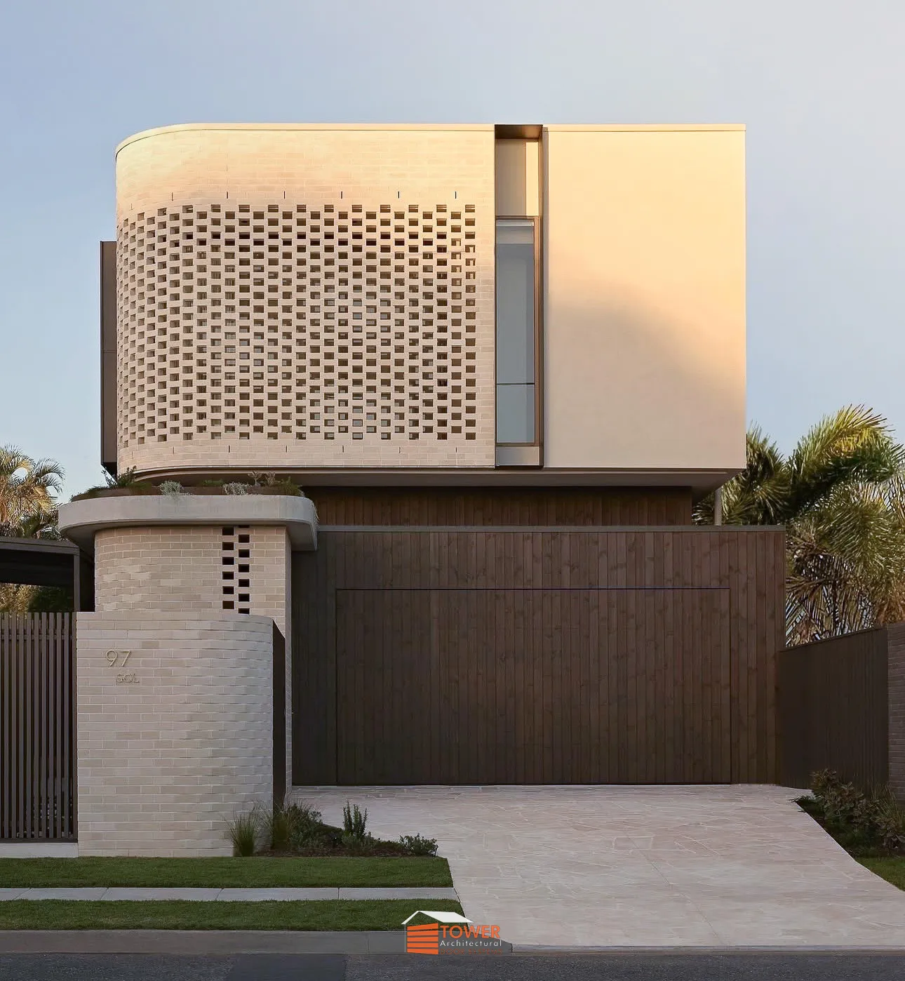 Architectural Range — Natural Series Location: Queensland Style Profile: This project showcases a refined Flushmount Pro door clad in natural timber shiplap, delivering a seamless and deeply architectural façade.