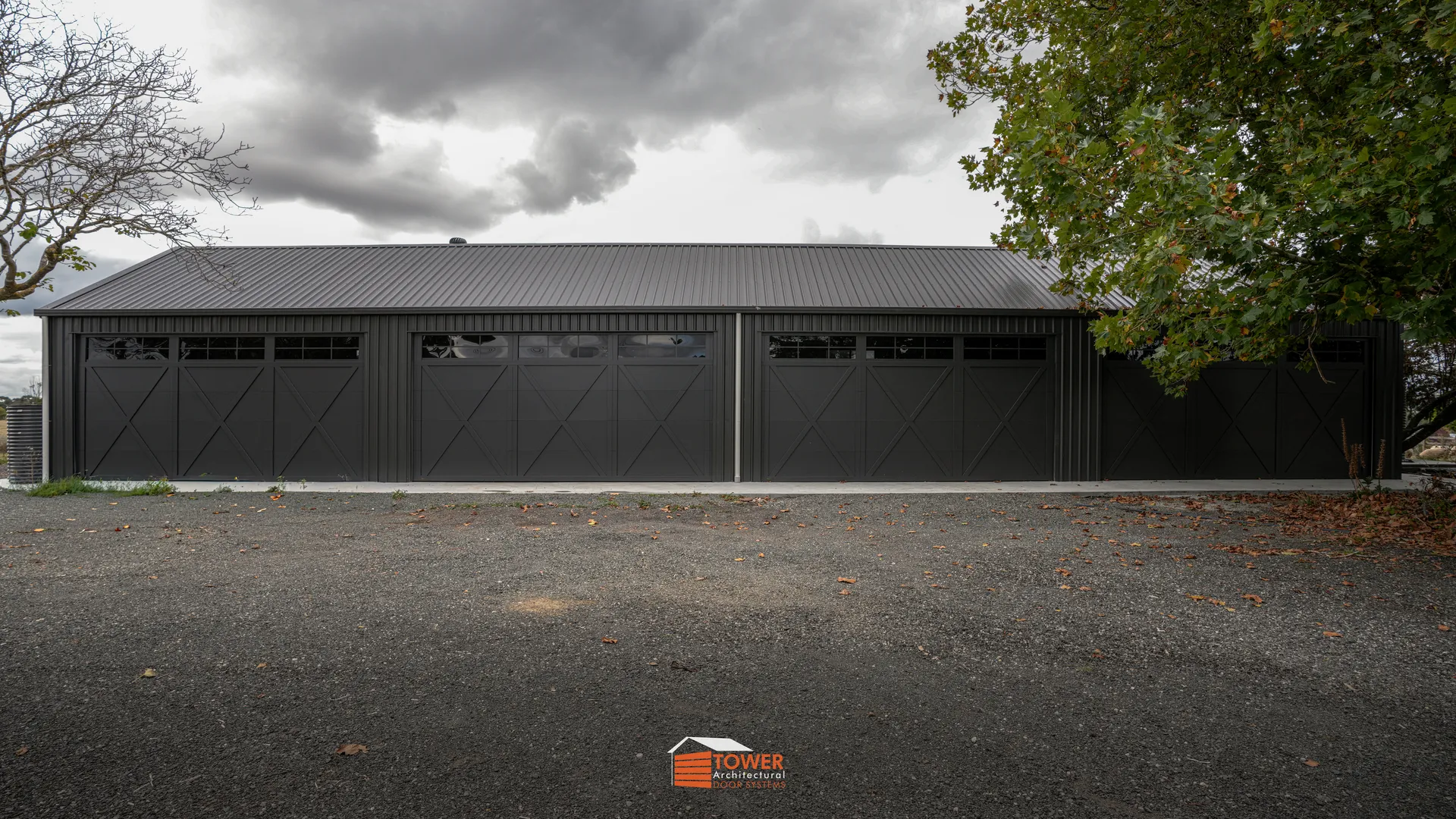 Architectural Range — XBarn Series Location: Rural Victoria Style Profile: A bold and rugged take on modern barn architecture, this project features our Behind Fit XBarn Series door finished in Textura Monument.
