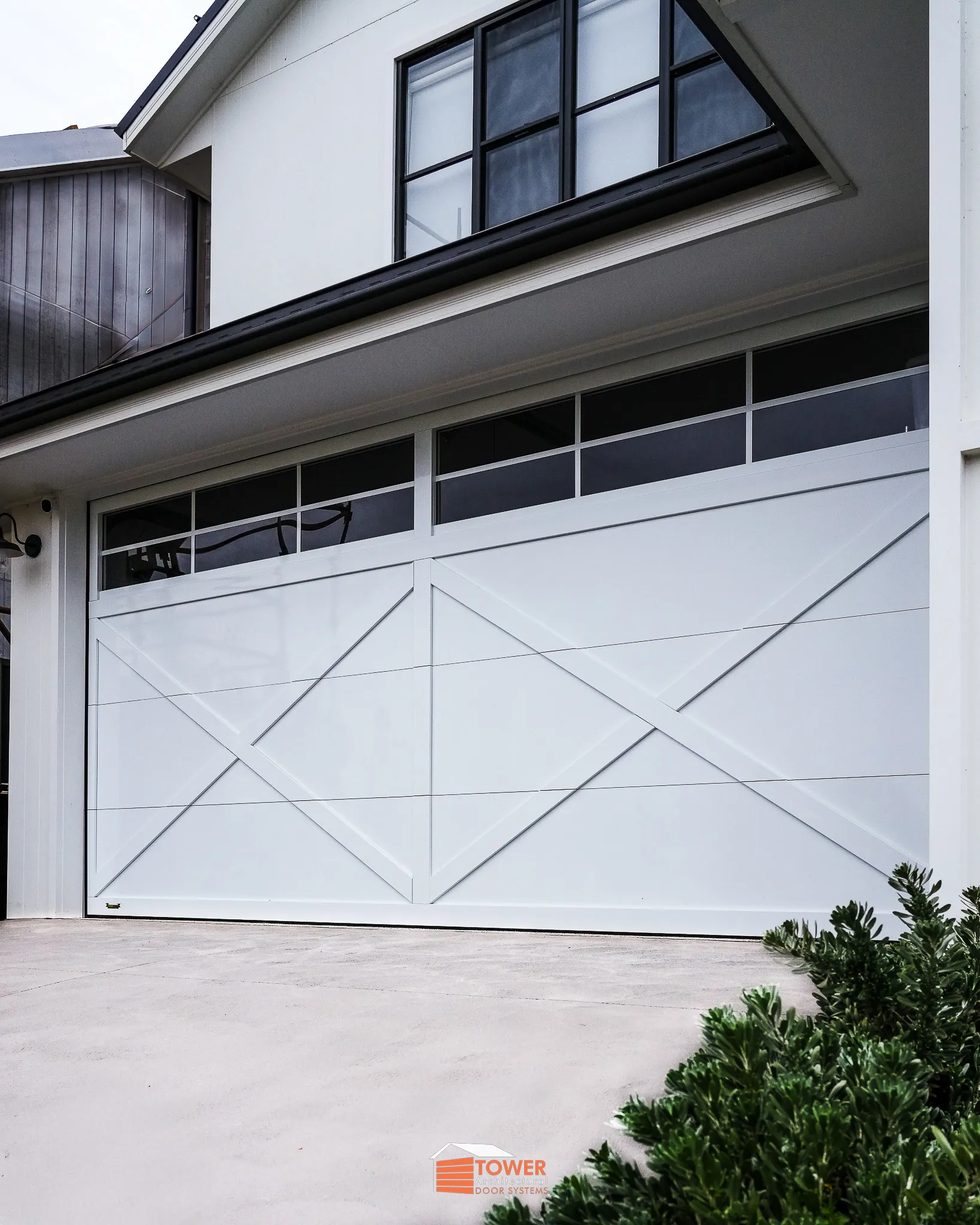 Architectural Range — XBarn Series Location: Sydney Style Profile: A crisp and refined interpretation of the classic barn-style door, this XBarn Series installation showcases a Gloss White finish that elevates the façade with brightness and clean architectural lines.