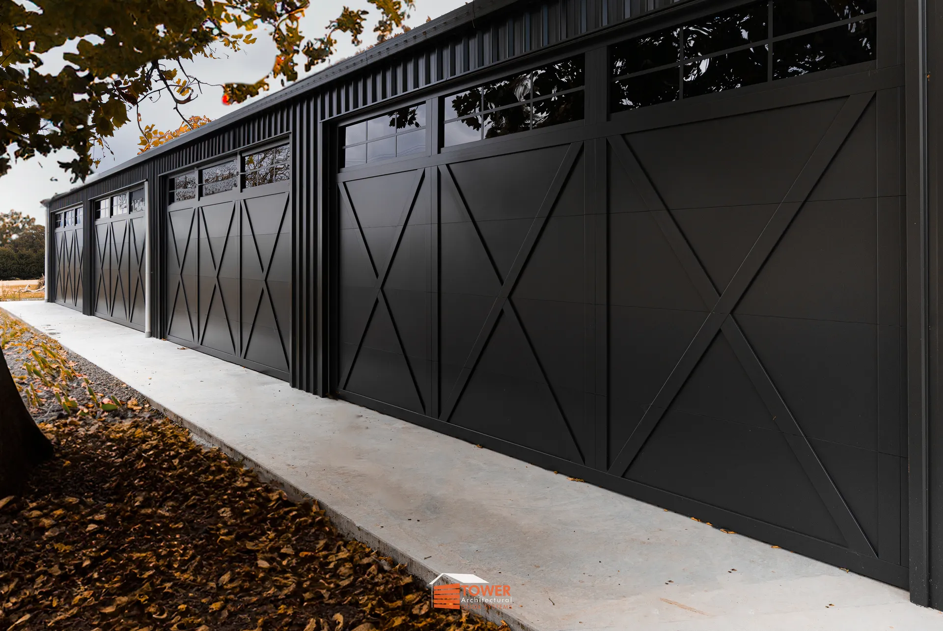 Architectural Range — XBarn Series Location: Rural Victoria Style Profile: A bold and rugged take on modern barn architecture, this project features our Behind Fit XBarn Series door finished in Textura Monument.